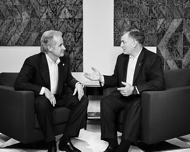 Two men in suits having a conversation