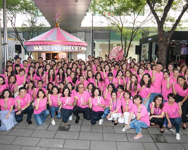 Group of people wearing pink for breast cancer awareness